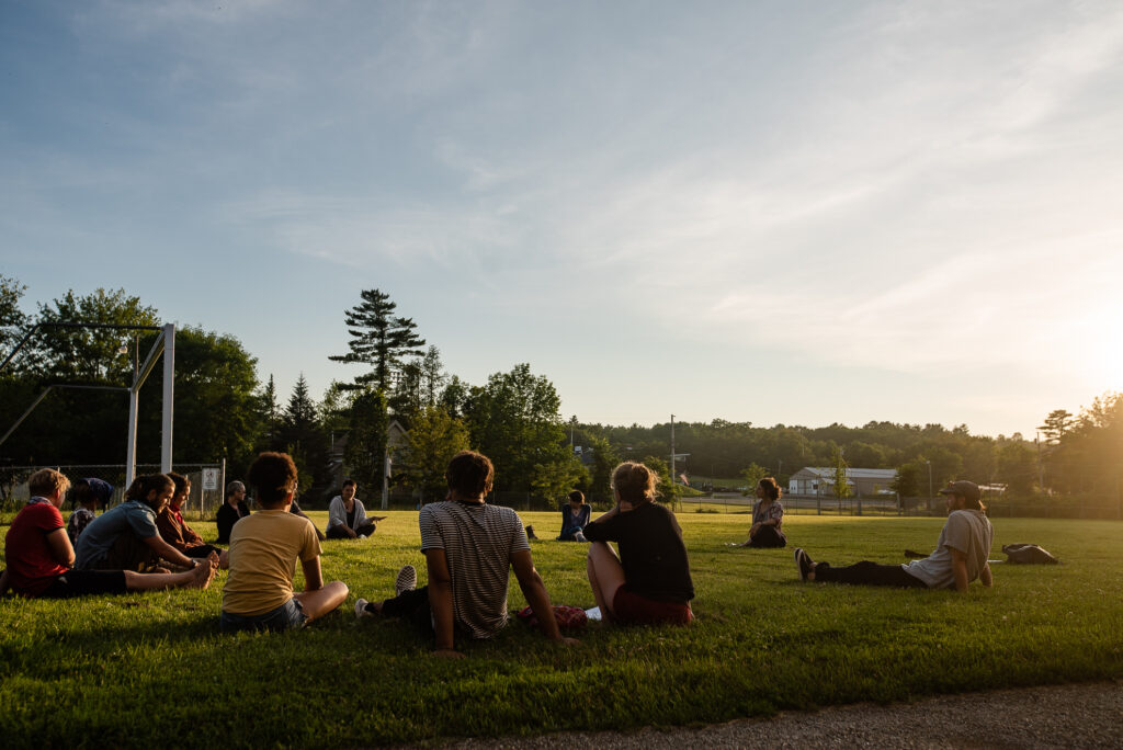 Socially engaged art conversation on the field behind Waterfall Arts.